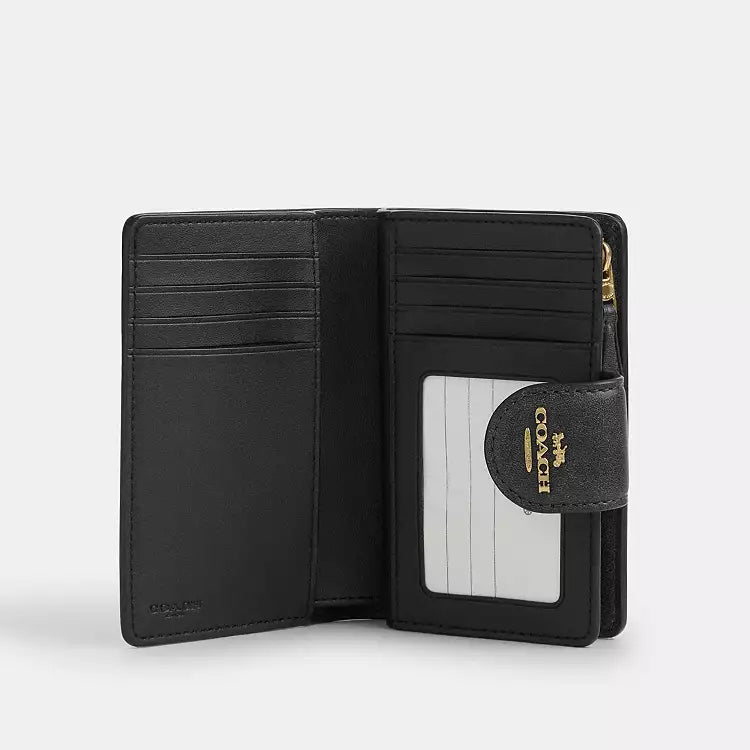 Coach Medium Corner Zip Wallet
In Loved Signature Canvas