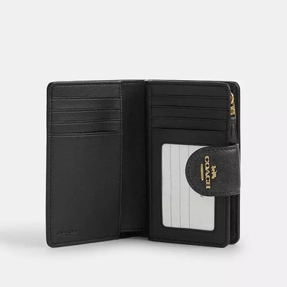 Coach Medium Corner Zip Wallet
In Loved Signature Canvas
