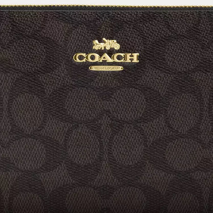 Coach Large Corner Zip Wristlet
In Signature Canvas
