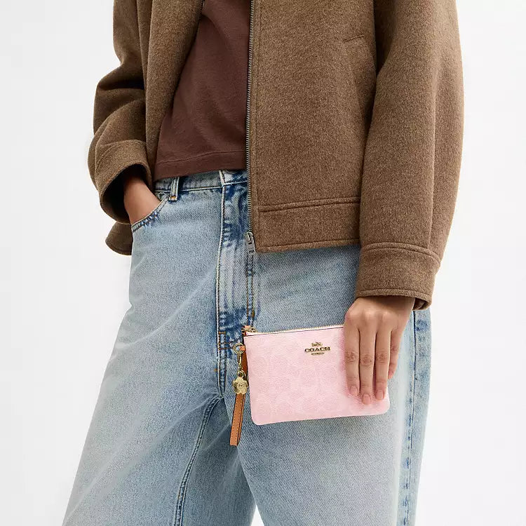 Coach Corner Zip Wristlet
In Signature Canvas With Charms