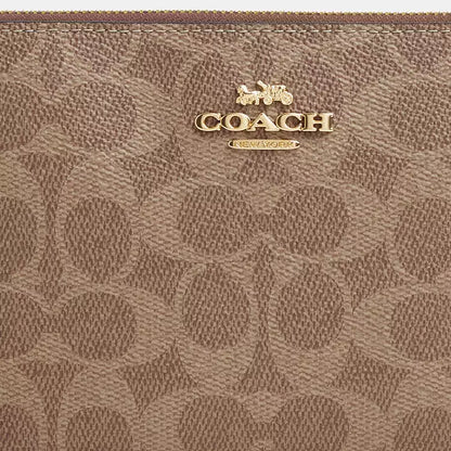 Coach Large Corner Zip Wristlet
In Signature Canvas
