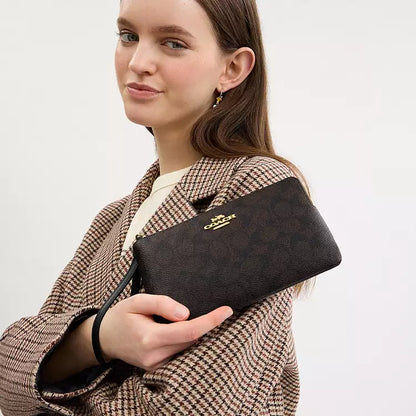 Coach Large Corner Zip Wristlet
In Signature Canvas